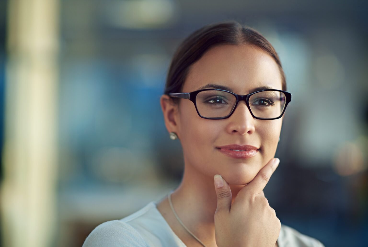 Woman glasses and closeup with confidence and thinking with vision idea or planning for hr Female employee and specs with hand for thought in office onboarding or staff for workforce in Atlanta