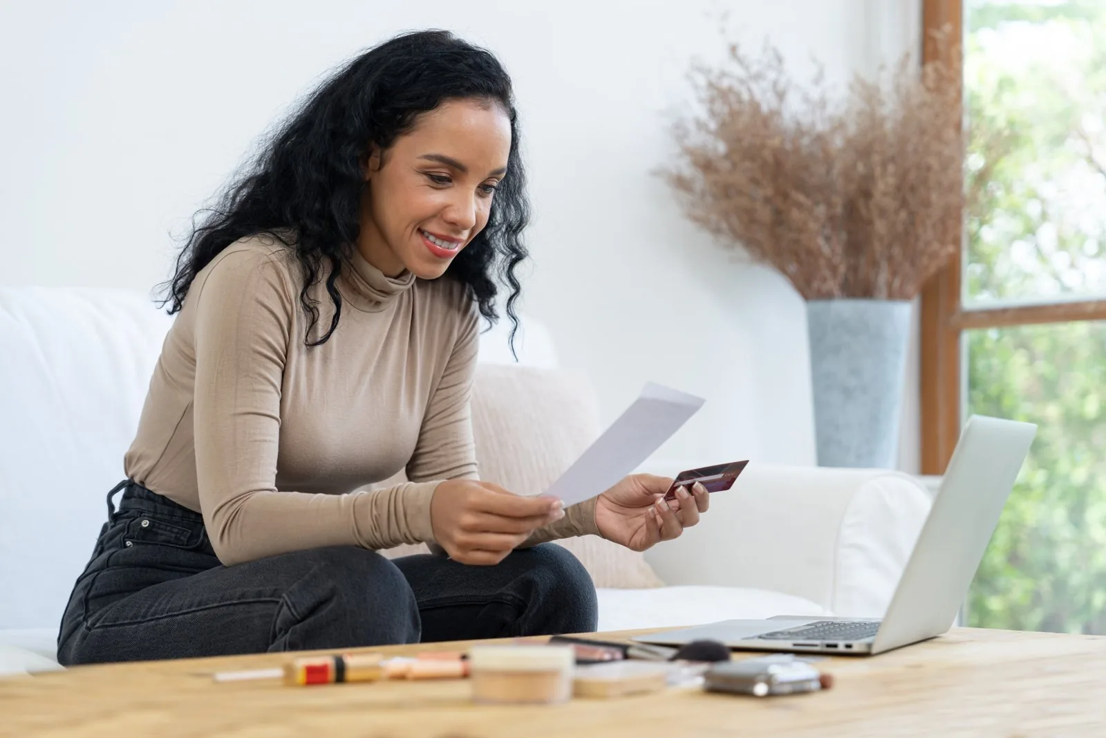 young happy woman buy product by online shopping with crucia 1